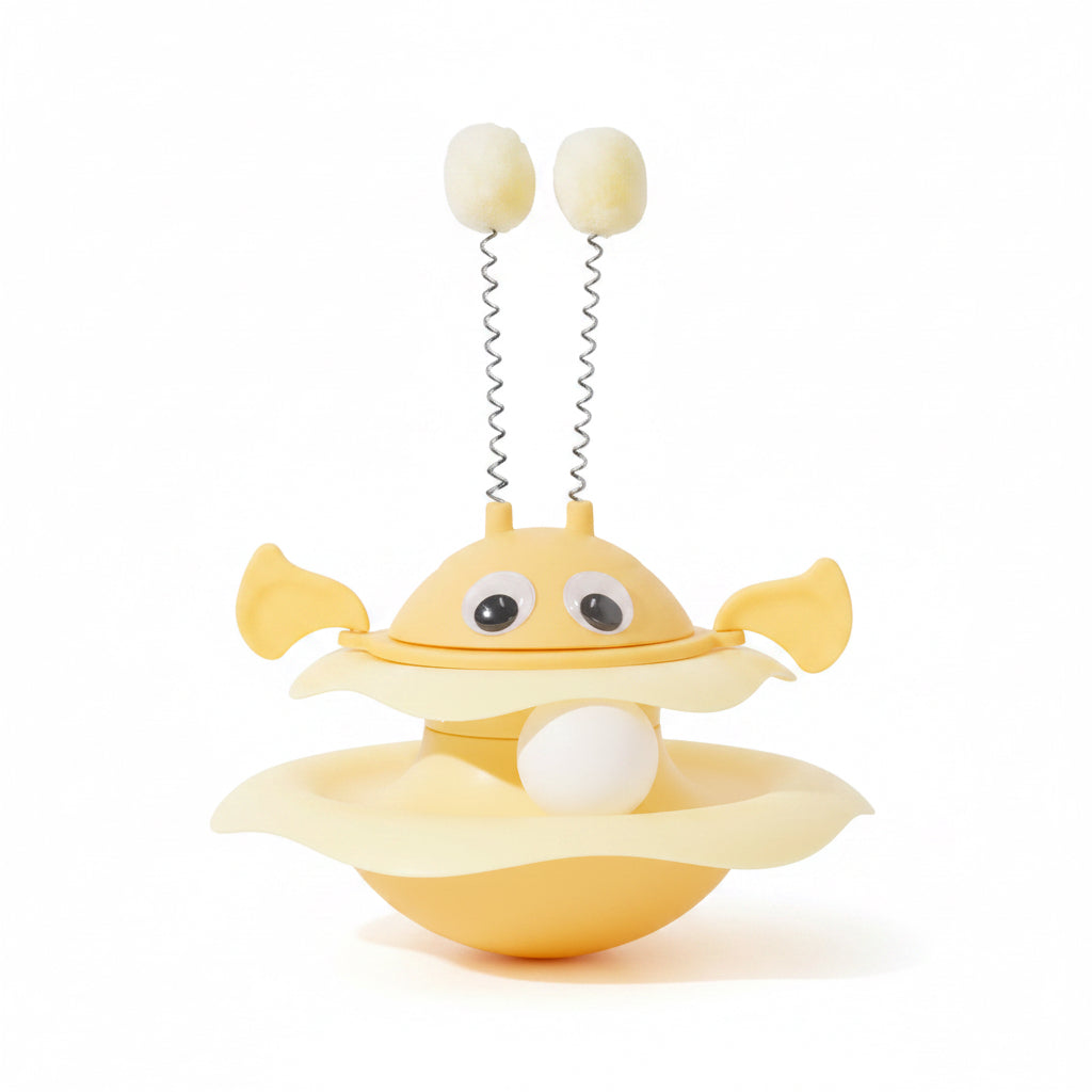 Yellow cartoon-like object with a white ball 